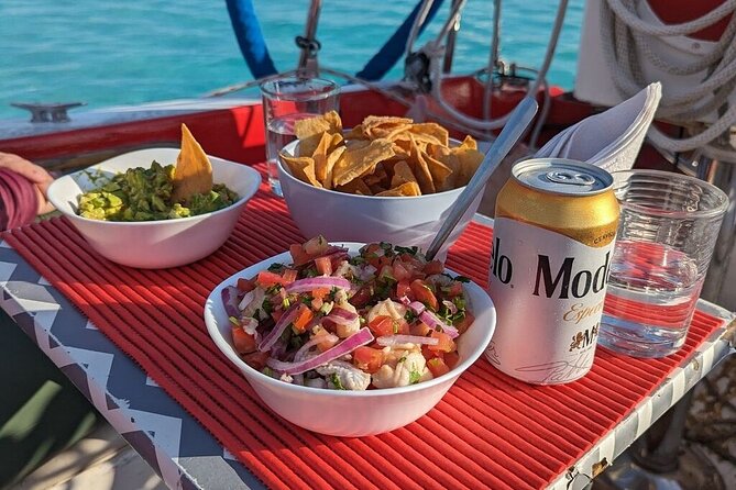 6hrs of Sailing in Bacalar Lagoon: discover Cenotes, Islands and Stromatolites. - What’s included on board: guacamole, ceviche lunch, and beers