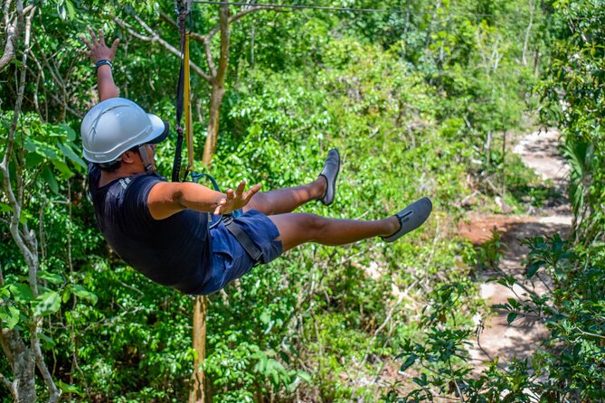 Action-packed Cancun ATV tour, Ziplines, Cenote, Lunch and More - Zip lines and suspension bridges: short flights, real platform caution
