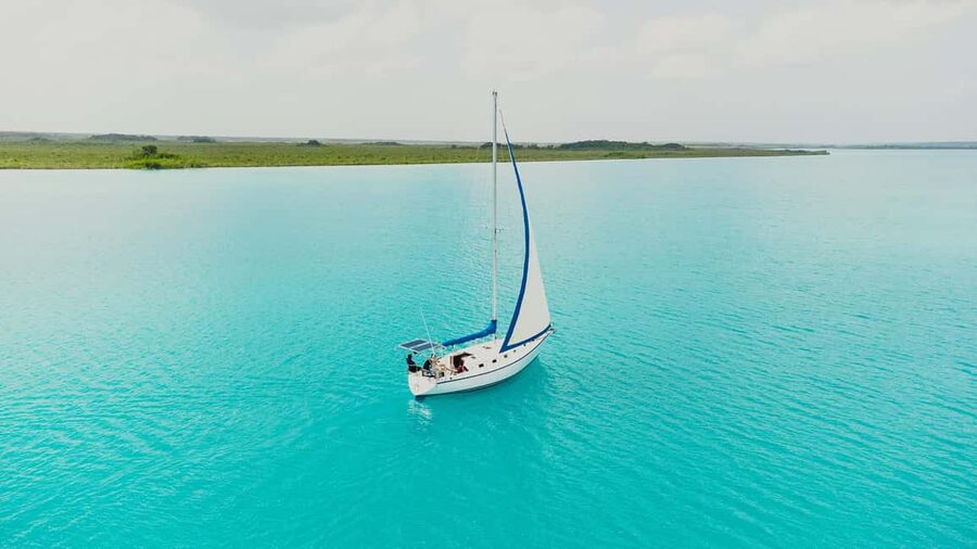 Bacalar Lagoon Sailing Tour with Open Bar and Mexican Lunch - Swimming in crystal turquoise water, with fewer headaches
