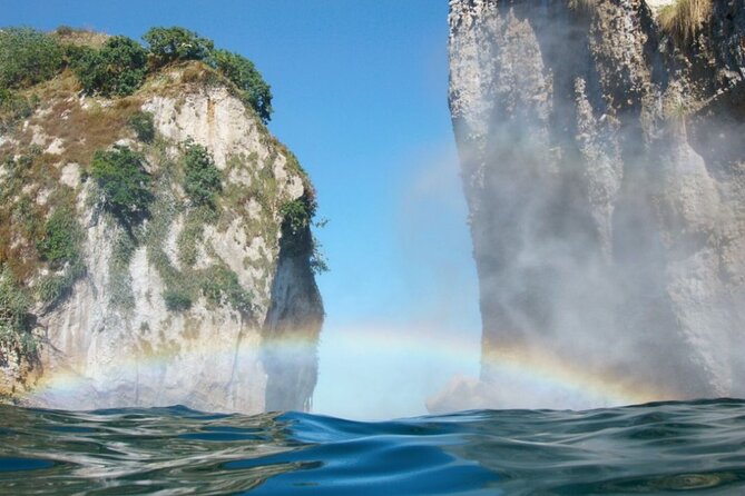 Boat and Snorkel Tour to 5 Islands of Los Arcos - Entering the caves and snorkeling in a safe, planned spot