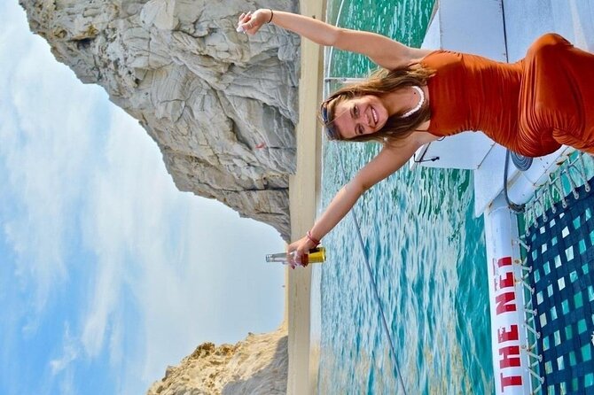 Cabo San Lucas Sunset Cruise with Unlimitted Drinks - Onboard atmosphere: music, party energy, and seating comfort