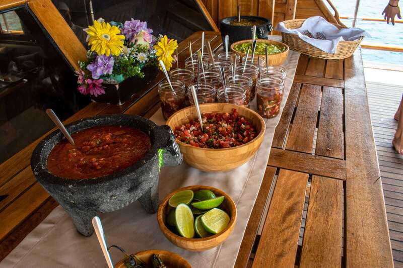 Cabo San Lucas: Sunset Yacht Cruise w/Chef Dinner & Open Bar - Dinner on the lower deck: Baja Duo, windows, and dessert with ate jam