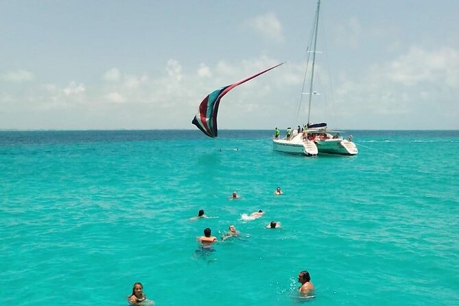 Cancun Sailing Catamaran Islas Mujeres With Luxury Beach Club - Isla Mujeres beach club time: pool, shade, and buffet food