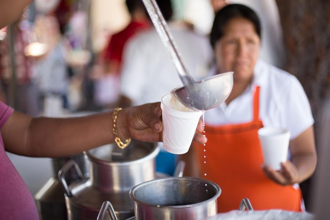 Cancun Street Food Tour with Food Stalls, Local Market and Murals - Stop 3 at Lonchería El Pocito: Yucatecan salbute crunch plus slow-cooked barbacoa