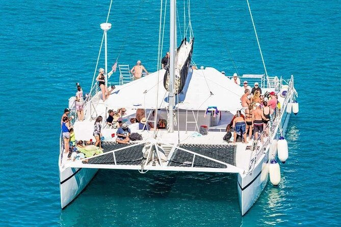 Catamaran Tour to Isla Mujeres from Cancún with Bar and Lunch - Onboard experience: party energy, music, and drinks