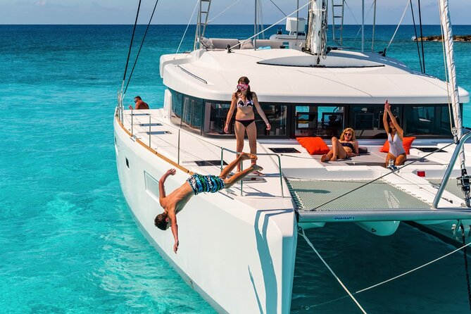 Catamaran Tour to Isla Mujeres from Cancún with Bar and Lunch - The snorkeling stop near Isla Mujeres: guide, gear, and crowd reality