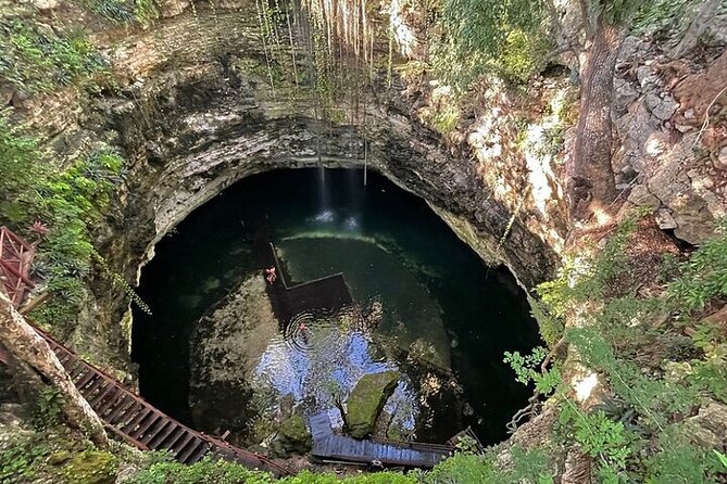 Chichén Itzá Premium Cenote y valladolid Day Tour - Cenote Chichikán: stairs down, rescue vests, and the Xibalba feel