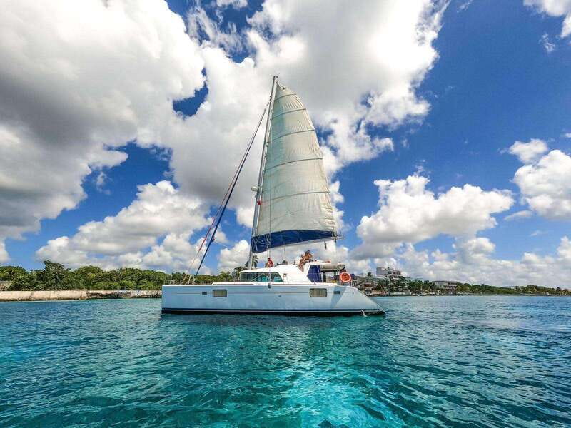 Cozumel: Catamaran Tour To Isla de la Pasión - Isla time: sunbathing, floating hammocks, and a clock you should respect