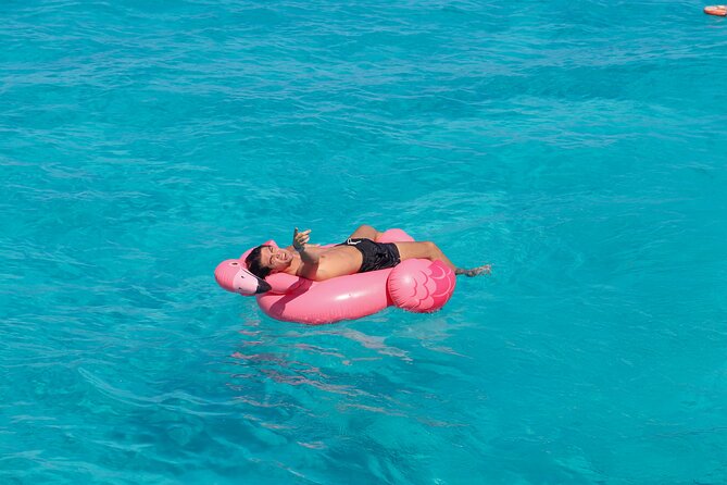 Dancer Cruise Isla Mujeres Snorkel Food and Drinks Included - Slide and trampoline in the sea: the playful half-hour break