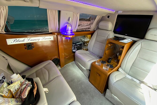 Deluxe GMC Limousine from CUN Airport to Playa Mujeres - What You Get Onboard: Drinks, WiFi, Nespresso, and Comfort
