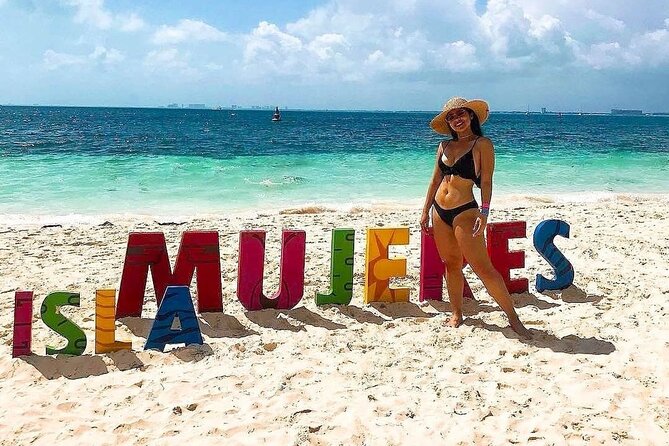 Exciting Catamaran Tour to Isla Mujeres, from Cancún! - Life onboard: open bar, music, and crew energy