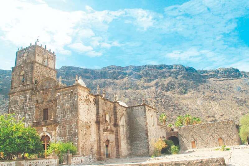 From Loreto: Historical San Javier Mission Tour with Lunch - San Javier village streets, fruit trees, and olive gardens
