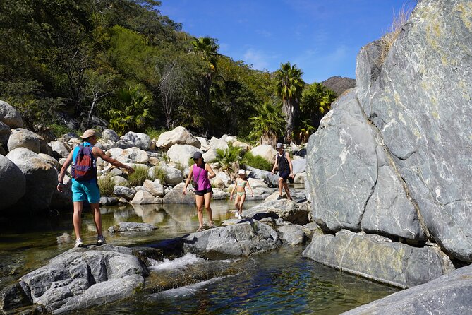 Hidden Waterfalls Hiking Adventure - Waterfall time in Santiago: swimming, jumping, and a natural pedicure