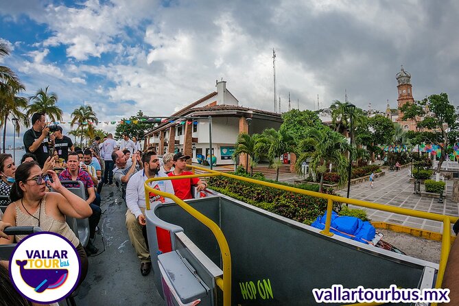 Hop On Hop Off Tour with Free Stops in Puerto Vallarta - Returning north: Guadalupe church stop, Vallarta Theater, and the Argentine Cow