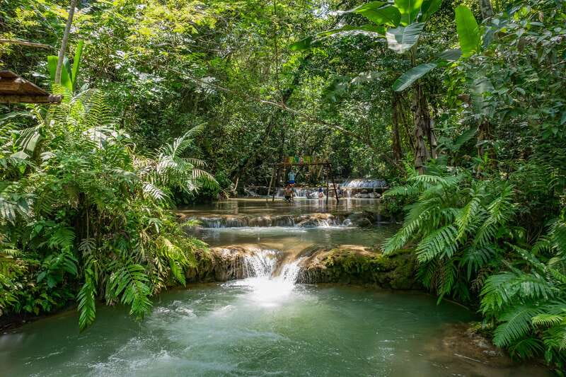 Huatulco: Mountain Waterfall Tour with Local Lunch - The riverbank hike and Copalitilla waterfall approach