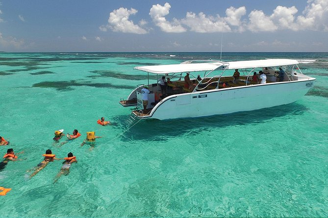 Isla Contoy and Isla Mujeres Tour with Snorkeling from Cancun - Lunch on Isla Contoy: Mayan-style BBQ and the open-bar later