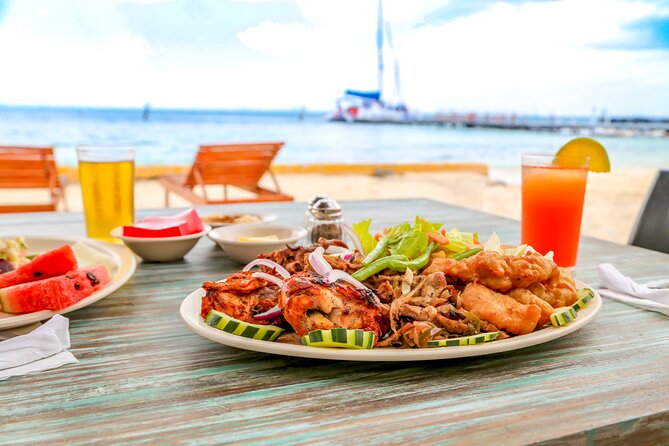 Isla Mujeres Catamaran Tour with Open Bar, Lunch and Snorkeling - Isla Mujeres beach club and buffet lunch: where the day slows down