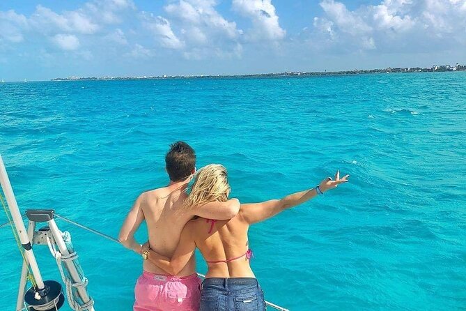 Isla Mujeres Catamaran Tour with Snorkel, Open bar and Transport - Onboard atmosphere: open bar, music, and how the day feels on deck