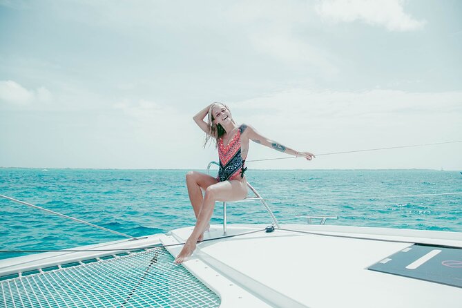 Isla Mujeres Cruise with Beach Club, Snorkel, Lunch and Open Bar - Catamaran ride comfort, crew energy, and the open bar vibe