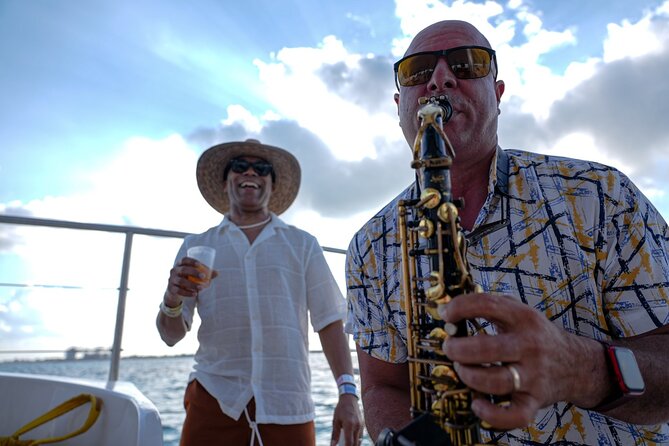 Isla Mujeres Sunset Cruise and Tour from Cancun - Boarding the Boat: Drinks, Safety Briefs, and the Saxophone Factor