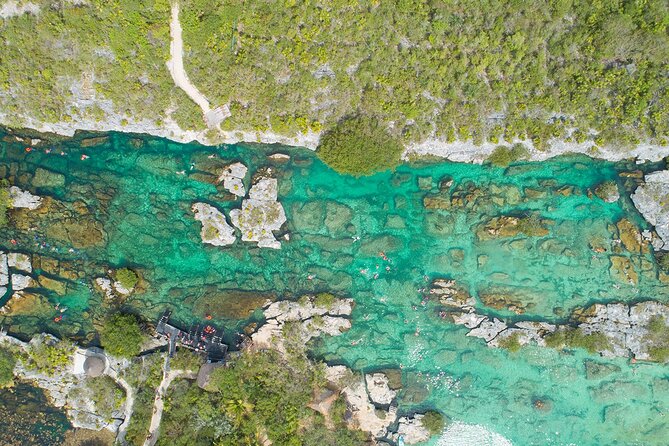 Magical Cenote and Paradise Lagoon Snorkeling Adventure - Snorkeling at Yal Ku Lagoon: warm-ish water and fish spotting