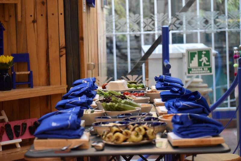 Mexico City: Authentic Mexican Cooking Class & Market Tour - Entering Roma Norte: the cooking studio setup and first sips