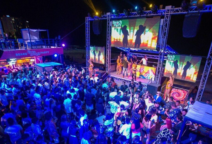 Neon Glow night Beach Party Regular - From Plaza Forum check-in to partying until 3 AM