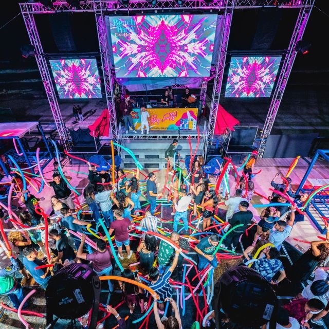 Neon Glow night Beach Party Regular - DJs, MC pacing, and the fire, pyrotechnics, dancers, champagne moments