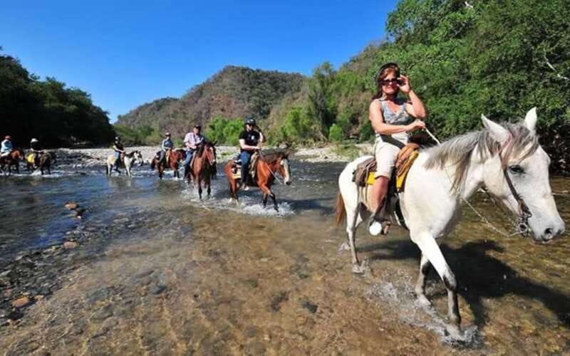 Puerto Escondido: Sunset Horse Back Riding Tour - Two hours on horseback through jungle trails, ceiba trees, and working countryside
