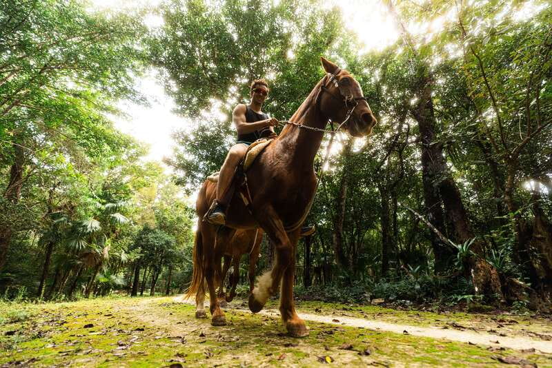 Riviera Maya: Horseback Ride, Zipline, and ATV Adventure - Entering El Rey Polo Country Club on Horseback