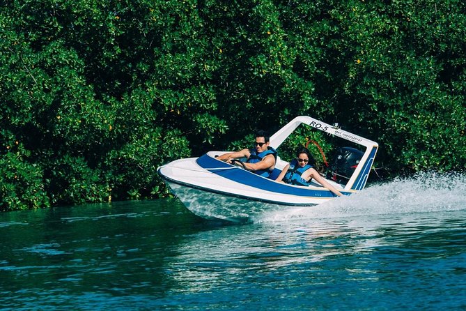 Speed Boat & Snorkel Tour with transportation ( only Cancun zone area) - Driving a powerboat after a short training session
