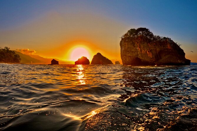 Sunset and Bioluminescence Boat Tour at Los Arcos Islands - Snorkeling in dark caves, what to expect, and how to feel confident