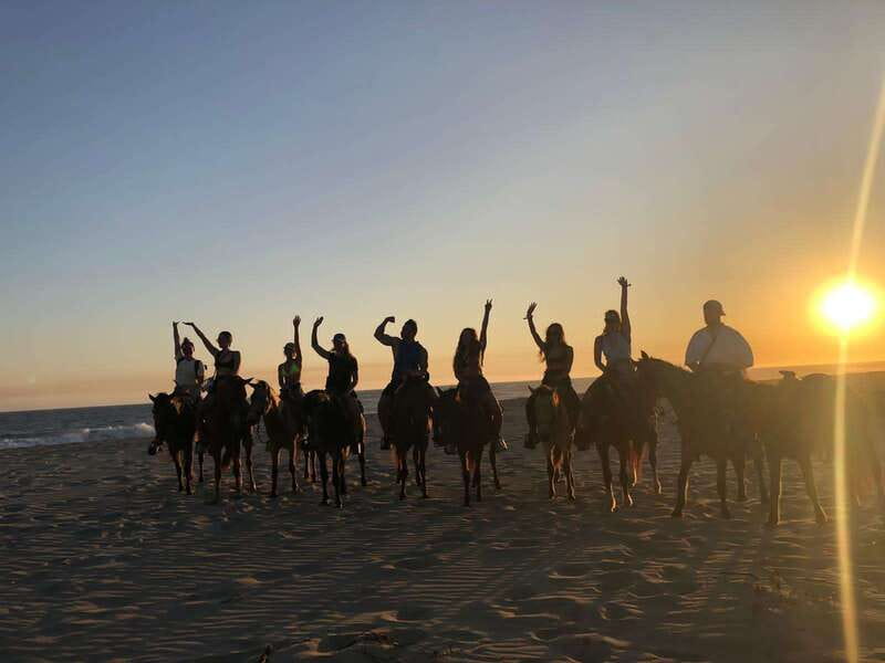 Sunset by Horse on the Beach - Fields, cattle land, and a river crossing before the beach