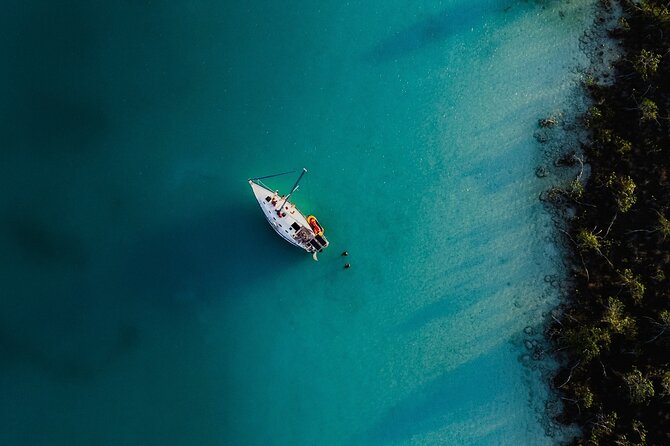 Sunset Sailing Tour in Bacalar with Outdoor Bar and Lunch - Pirate Canal swim: turquoise water, music, and party-friendly drinks