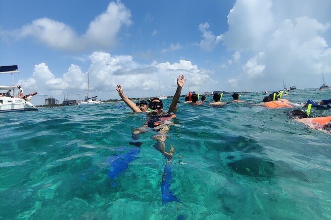 Top Isla Mujeres Catamaran Tour with Snorkel Open Bar and Buffet lunch - El Meco Reef snorkeling: short swim, safety first