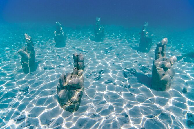 Top Isla Mujeres Catamaran Tour with Snorkel Open Bar and Buffet lunch - Icebar Beach Club and lunch: buffet time plus a cold-photo stop